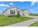 Beautiful single-Gathering home with a two-car garage, manicured lawn, and stone accents at 3528 Golden Wheat Ln, Plant City, FL 33565
