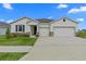 Inviting single-Gathering home with a two-car garage and stone accents at 3528 Golden Wheat Ln, Plant City, FL 33565