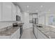 Modern kitchen featuring granite countertops, stainless steel appliances, and ample cabinet space at 3528 Golden Wheat Ln, Plant City, FL 33565