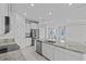 Open kitchen with granite countertops and stainless steel appliances at 3528 Golden Wheat Ln, Plant City, FL 33565
