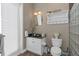 Bathroom with a vanity, toilet, shower and a towel rack at 3668 Janus Way, Palm Harbor, FL 34685