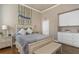 Cozy bedroom with a soft gray bedspread, neutral walls, and ample storage, perfect for a restful and organized living space at 3668 Janus Way, Palm Harbor, FL 34685