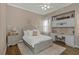 Serene bedroom with a decorative headboard, cozy rug, and functional desk area, providing a perfect blend of style and comfort at 3668 Janus Way, Palm Harbor, FL 34685
