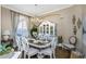 Elegant dining room featuring a chandelier and a china cabinet at 3668 Janus Way, Palm Harbor, FL 34685