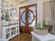 Elegant foyer with hardwood floors and stylish double door at 3668 Janus Way, Palm Harbor, FL 34685