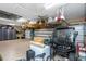 Spacious garage with installed overhead storage racks and cabinets at 3668 Janus Way, Palm Harbor, FL 34685