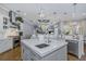 Gourmet kitchen featuring a large island, stainless steel appliances, and ample counter space at 3668 Janus Way, Palm Harbor, FL 34685