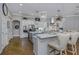 Spacious kitchen boasts stylish pendant lighting, marble countertops, and stainless steel appliances at 3668 Janus Way, Palm Harbor, FL 34685