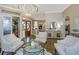 Bright living room with hardwood floors, double front doors and modern furnishings at 3668 Janus Way, Palm Harbor, FL 34685