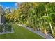 Turf area with lush landscaping and rock accents at 3815 W Obispo St, Tampa, FL 33629