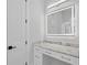 Stylish bathroom vanity with marble countertop, undermount sinks, and LED mirror at 3815 W Obispo St, Tampa, FL 33629
