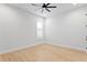 Bright bedroom with wood flooring, ceiling fan, and a modern aesthetic at 3815 W Obispo St, Tampa, FL 33629
