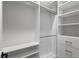 Walk-in closet with white shelving and drawers, providing ample storage space at 3815 W Obispo St, Tampa, FL 33629