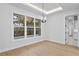 Dining room area with hardwood floors, modern lighting, and a view of the pool at 3815 W Obispo St, Tampa, FL 33629