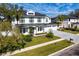 Aerial view of a two-story home with a three-car garage and beautifully landscaped yard at 3815 W Obispo St, Tampa, FL 33629