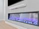 Close-up of fireplace with an electric insert, TV and soundbar in a modern living room at 3815 W Obispo St, Tampa, FL 33629