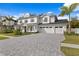 Charming two-story home with a three-car garage and wide driveway at 3815 W Obispo St, Tampa, FL 33629