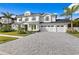 Beautiful two-story home with a well-manicured front yard and a spacious driveway at 3815 W Obispo St, Tampa, FL 33629