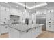 Modern kitchen with stainless steel appliances, spacious island, and open layout, ideal for entertaining at 3815 W Obispo St, Tampa, FL 33629