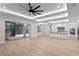 Open concept living room flows into a gourmet kitchen and offers access to the outdoor space at 3815 W Obispo St, Tampa, FL 33629
