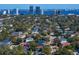 Aerial shot of a suburban neighborhood with water views and downtown buildings at 3815 W Obispo St, Tampa, FL 33629