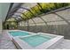 Enclosed outdoor pool with jacuzzi, ideal for relaxation at 3815 W Obispo St, Tampa, FL 33629