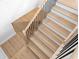 Modern staircase with wooden steps and sleek black railings at 3815 W Obispo St, Tampa, FL 33629