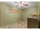 Simple bedroom featuring tiled floor and a window at 403 Indian Meadow Ct, Wimauma, FL 33598