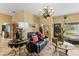 Bright living room with comfortable seating, stylish decor, and view to outside at 403 Indian Meadow Ct, Wimauma, FL 33598