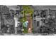 Aerial view of the home showcasing the entire property, surrounding neighborhood, and mature trees at 4424 19Th N St, St Petersburg, FL 33714