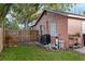 Side view of backyard with storage and mechanical systems at 4424 19Th N St, St Petersburg, FL 33714