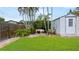 Large backyard boasts green grass and a storage shed at 4424 19Th N St, St Petersburg, FL 33714