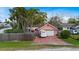 A charming single-story home featuring a brick facade, a one-car garage, and a well-maintained lawn at 4424 19Th N St, St Petersburg, FL 33714