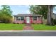 Charming brick home with a well-maintained front lawn and inviting front entrance at 4424 19Th N St, St Petersburg, FL 33714