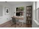 Bright home office space featuring a modern desk, sleek shelving, and a window view at 4424 19Th N St, St Petersburg, FL 33714