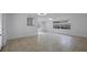 Neutral tile flooring and bright white walls fill this light-filled living space with recessed lighting at 4424 19Th N St, St Petersburg, FL 33714