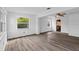 Spacious living room with neutral walls, ceiling fan, and light wood-look flooring at 4424 19Th N St, St Petersburg, FL 33714