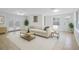 Inviting living room with ample natural light, a plush sofa, and stylish decor, perfect for relaxing at 4424 19Th N St, St Petersburg, FL 33714
