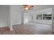 Bright living room with white walls, wood-look floors, and a ceiling fan at 4424 19Th N St, St Petersburg, FL 33714