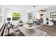 Bright living room featuring hardwood floors, white walls, and a dining area at 4424 19Th N St, St Petersburg, FL 33714