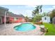 Relaxing backyard pool with a brick patio, shed, and comfortable lounge seating at 4424 19Th N St, St Petersburg, FL 33714