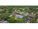 An aerial view of a suburban neighborhood featuring green lawns, mature trees, and various single Gathering homes at 4714 Kemble Ct, Tampa, FL 33624