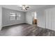 Bright bedroom with a ceiling fan and an adjacent bathroom for convenience at 4714 Kemble Ct, Tampa, FL 33624