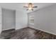 Bedroom features tile floor, a window with blinds, and a ceiling fan at 4714 Kemble Ct, Tampa, FL 33624