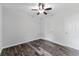 Bedroom features wood-look tile flooring, a ceiling fan, and a closet at 4714 Kemble Ct, Tampa, FL 33624