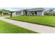 Charming home with a well-manicured lawn, lovely landscaping, and an attached two-car garage at 4714 Kemble Ct, Tampa, FL 33624