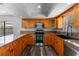 Modern kitchen featuring stainless steel appliances and granite countertops at 4714 Kemble Ct, Tampa, FL 33624