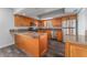 Updated kitchen with stainless steel appliances, granite countertops, and wood cabinets at 4714 Kemble Ct, Tampa, FL 33624