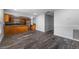 Open living area featuring modern floors leading to the kitchen with modern appliances at 4714 Kemble Ct, Tampa, FL 33624