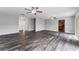 Bright living room offering wood-look tile flooring and a seamless flow into the kitchen area at 4714 Kemble Ct, Tampa, FL 33624